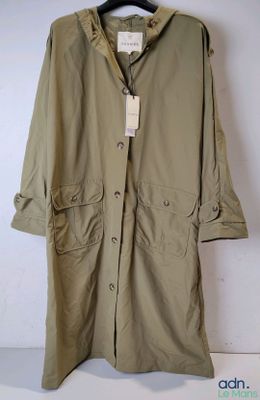 an image of a coat hanging on a hanger on a wall