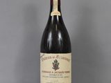 a bottle of wine that is sitting on a table