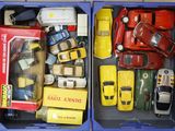 two blue boxes with toy cars in them on a table