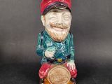 a figurine of a man with a beard and a red hat