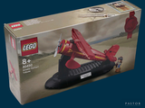 a box of legos with a red plane in it