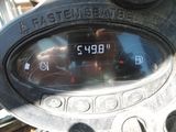a close up of a digital clock on a motorcycle