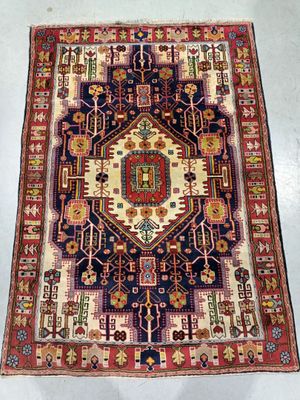 a large rug with a geometric design on a white floor