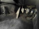 a close up of a car ' s floor with pedals on it