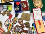 many medals and medals that are on a table