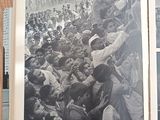 several black and white photos of a crowd of people on a wooden floor