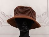 an image of a mannequin head wearing a brown hat