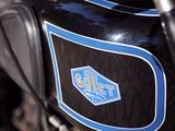 a close up of a motorcycle with a logo on it