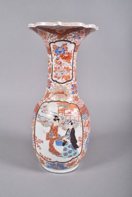 a vase that has a picture of a woman on it