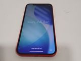 the back of a red iphone xr sitting on a white table