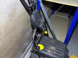a yellow and black suitcase sitting on a pallet in a warehouse