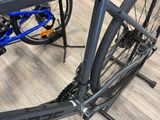 a bike that is sitting on a stand on the floor