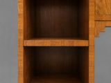 an art deco walnut desk with drawers and shelves