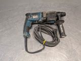 a drill that is laying on the floor