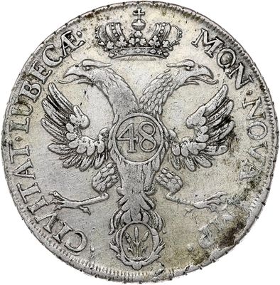 a close up of a coin with a bird on it