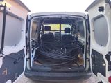 a white van with a bunch of wires in the back of it