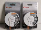 pair of two white knobs on a white surface with a white background