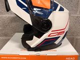an orange and white box with a helmet on top of it