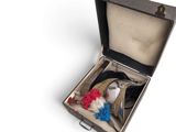 an open suitcase with a stuffed animal inside of it