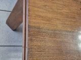 a wooden table with a drawer on top of it