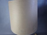 a lamp that is sitting on a stand on a table