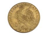 a close up of a gold coin with a rooster on it