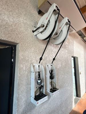 a wall with a bunch of electrical equipment hanging on it