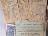 some old papers are piled on top of each other on a table