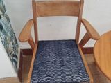 two chairs and a table in a room