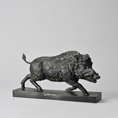an image of a statue of a boar running on a marble base