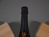 a bottle of wine that is sitting on a table