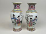 pair of chinese vases with ladies and trees painted on them