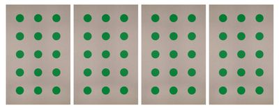 a set of four green polka dot stickers on a white background