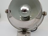 two lamps that are sitting on a white surface