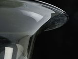 a close up of a glass vase with a black background