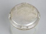 an antique silver plated box with a lid on a white surface