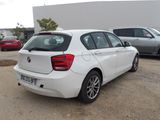 a white car that is parked in a parking lot