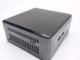 an image of a small computer sitting on top of a white surface