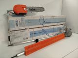 a chainsaw and a tool on top of a stack of boxes