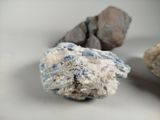 some rocks that are sitting on a white surface