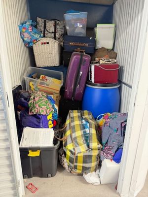 a small storage room with a lot of bags and luggage