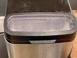 an image of a silver and black ice maker on a counter