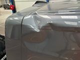 an image of a car that has been painted silver