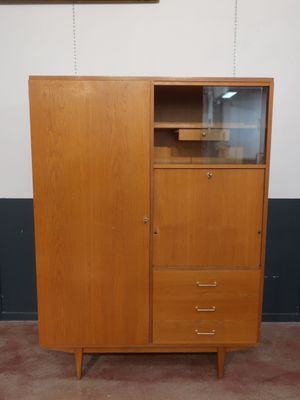 an image of a wooden cabinet with a glass door