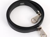 black leather dog leash with a metal hook and a carabine