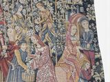 a tapestry with a picture of a group of people in a garden