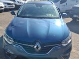 the blue car is parked in the parking lot near other cars