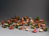 many different types of pottery sitting on a table