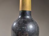 a bottle of wine that is sitting on a table
