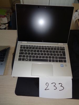 a laptop computer sitting on a desk with a price tag attached to it